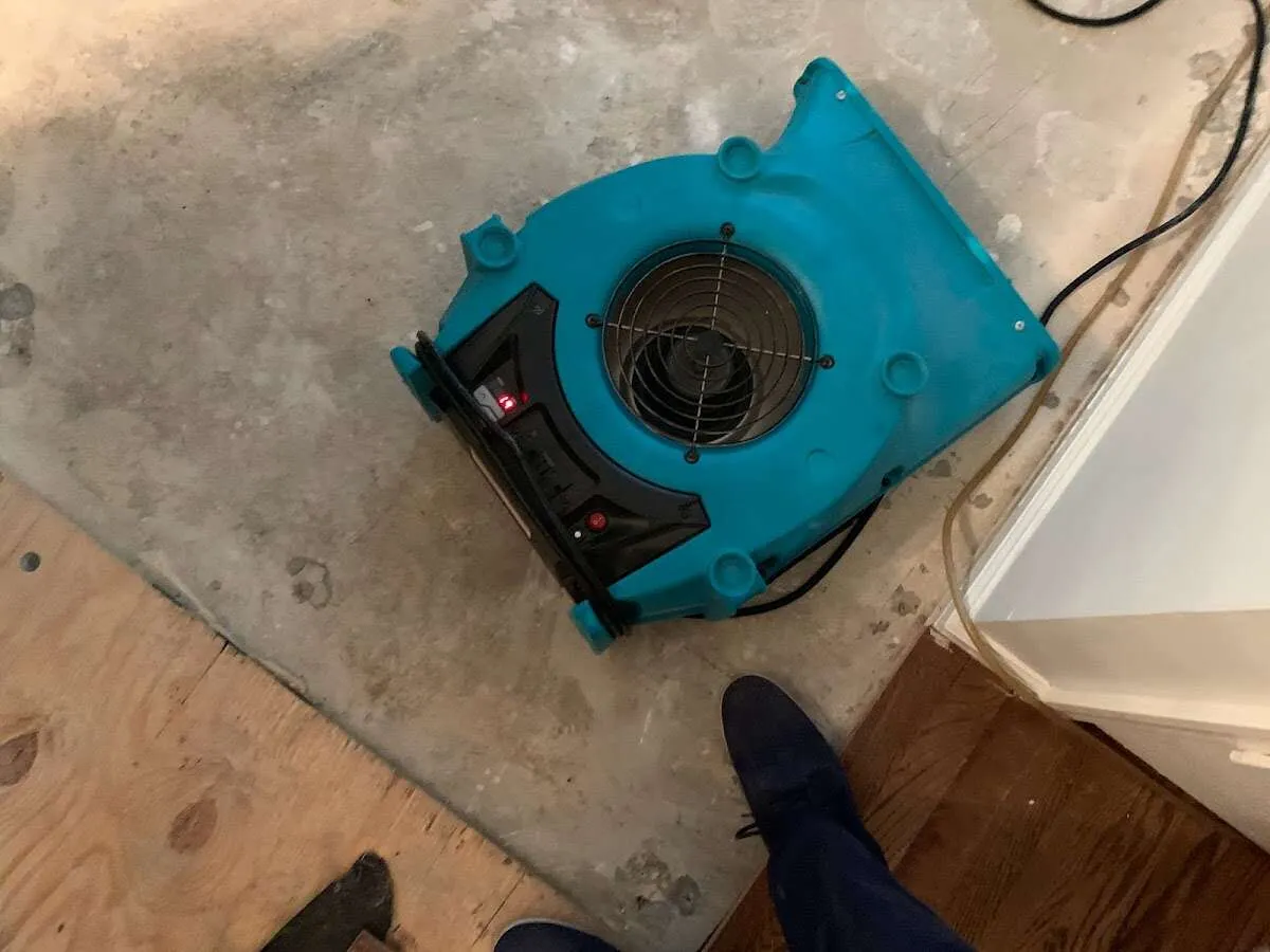 Air mover drying subfloor during Commercial Water Damage Restoration in Bermuda Dunes